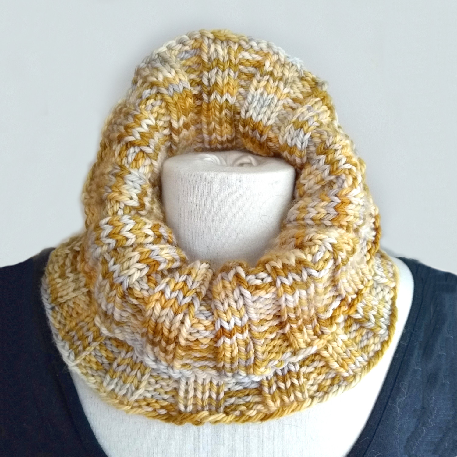 Chunky cowl worn higher up the neck