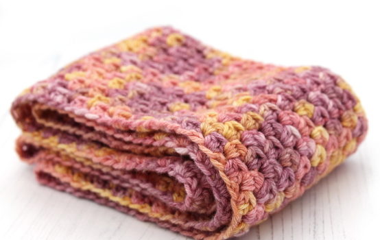 No Fuss Cowl easy crochet pattern in colourway Sunset Party, folded