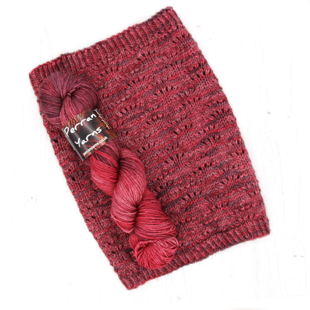 DK Tibetan yarn in hand dyed shade Raspberry Coulis with sample knitted Bouquet Cowl